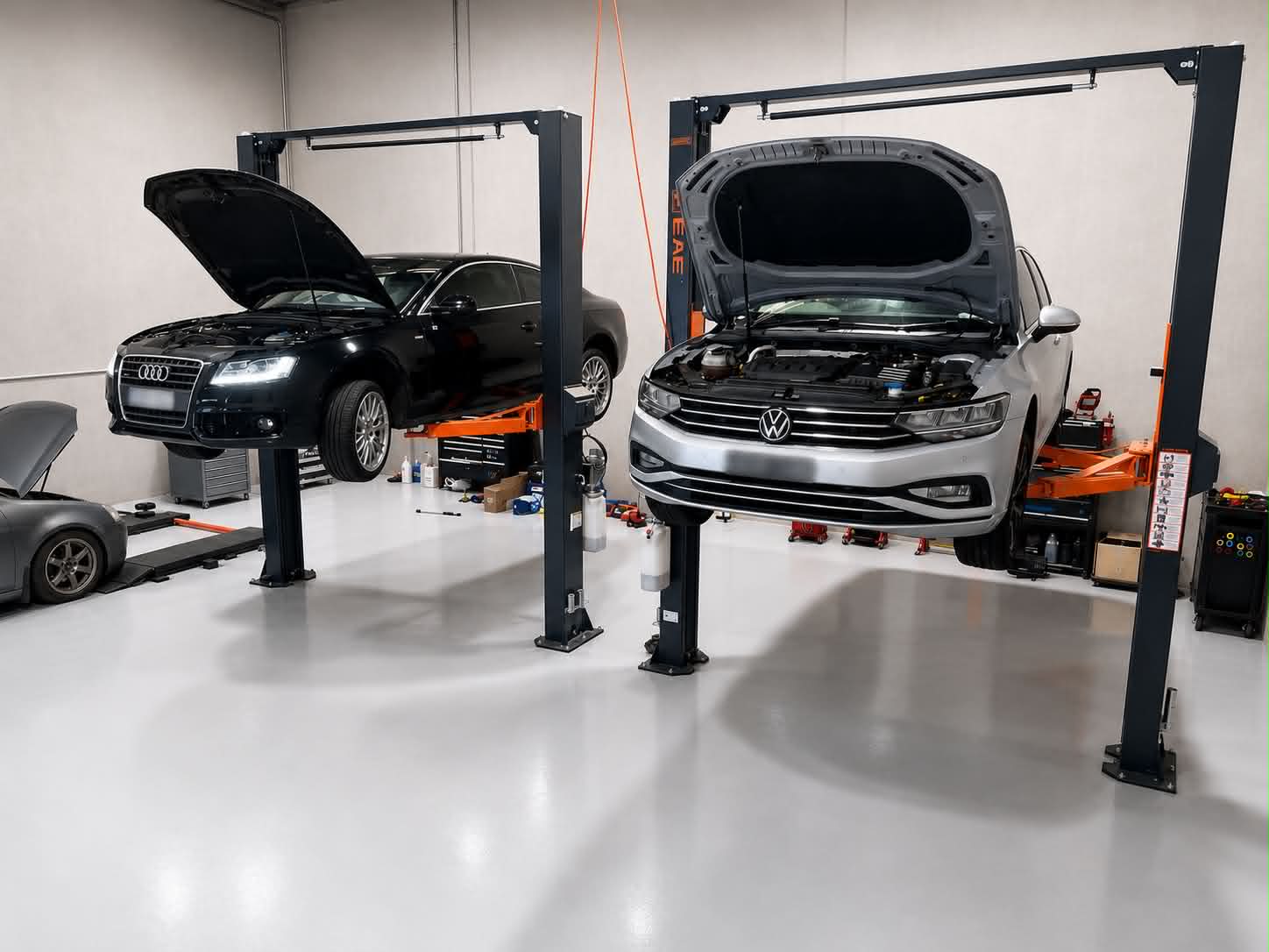 European vehicles on hoists inside Melbourne European Specialist workshop