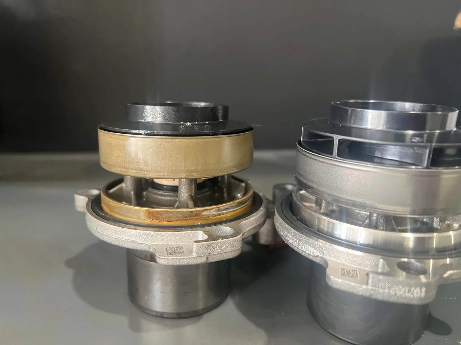 Failed water pump sleeve beside replacement unit